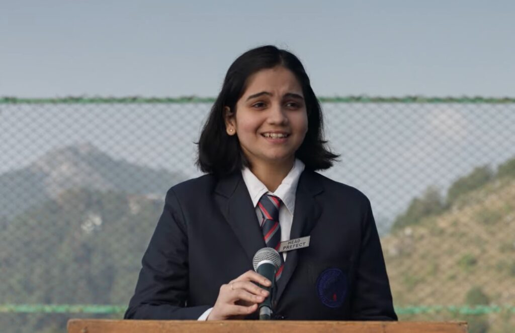 Preeti Panigrahi as the young schoolgirl addressing the school
