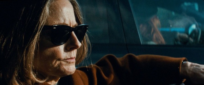 Jodie Foster in dark shades and driving in A Private Life