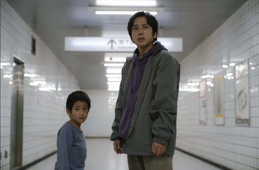 The young boy and the lost man team up to play the game together in Exit 8