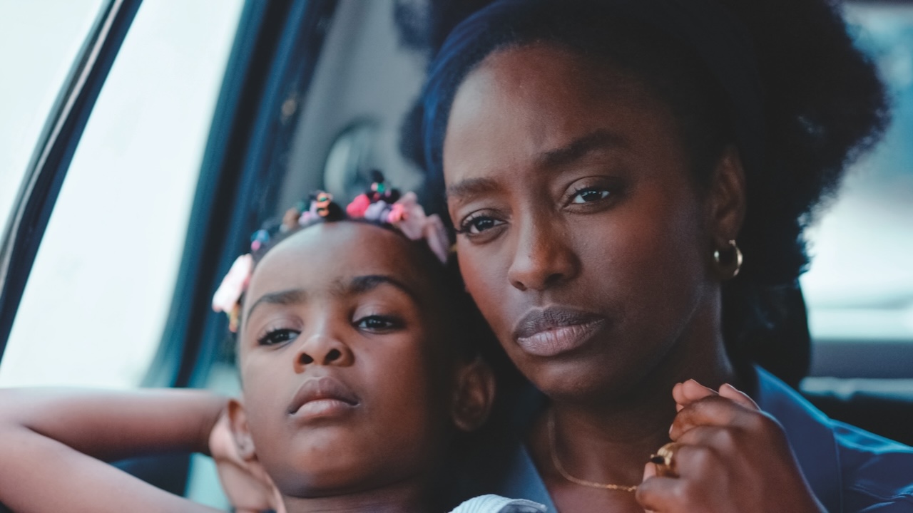 Marie (Aïssa Maïga) and Kenza (Estelle Kenza Dpgbo) in a taxi in Promised Sky.