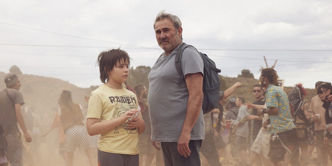 Luis and Esteban in a desperate search for Mar at the first rave in the film Sirât.