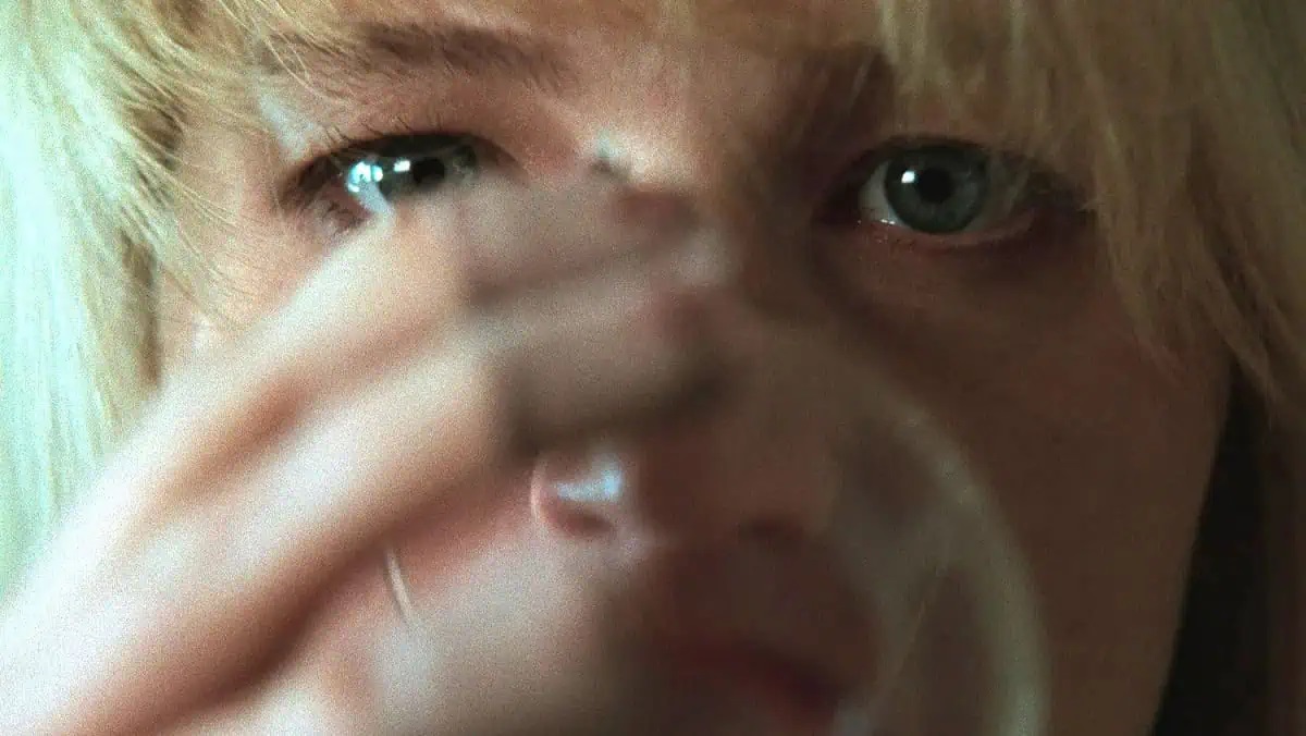 Grace (Jennifer Lawrence) drinks from a wine glass in Die My Love.