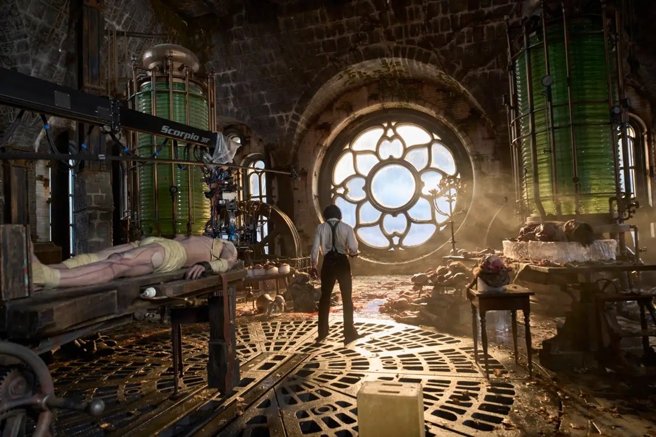 Victor Frankenstein (Oscar Isaac) putting together his creation (Jacob Elordi) together in Guillermo del Toro's Frankenstein.