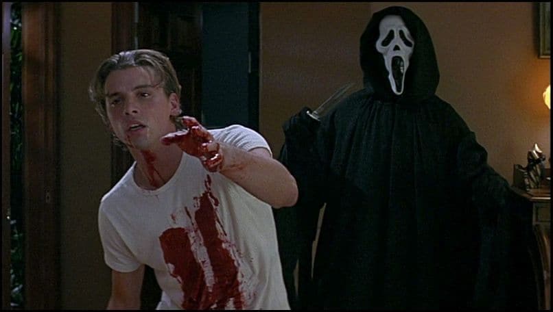 Skeet Ulrich as Billy is stabbed by Ghostface in Scream.