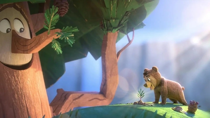 A cute bear cub and a pine tree with a face from the Best Animated Short Oscar nominee Forevergreen.