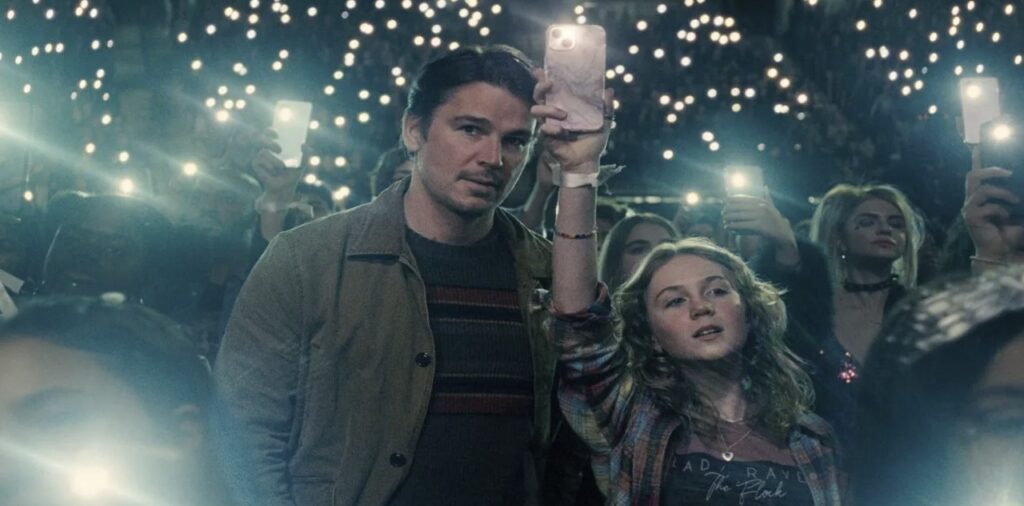 Father and daughter at a teenage pop concert in Trap