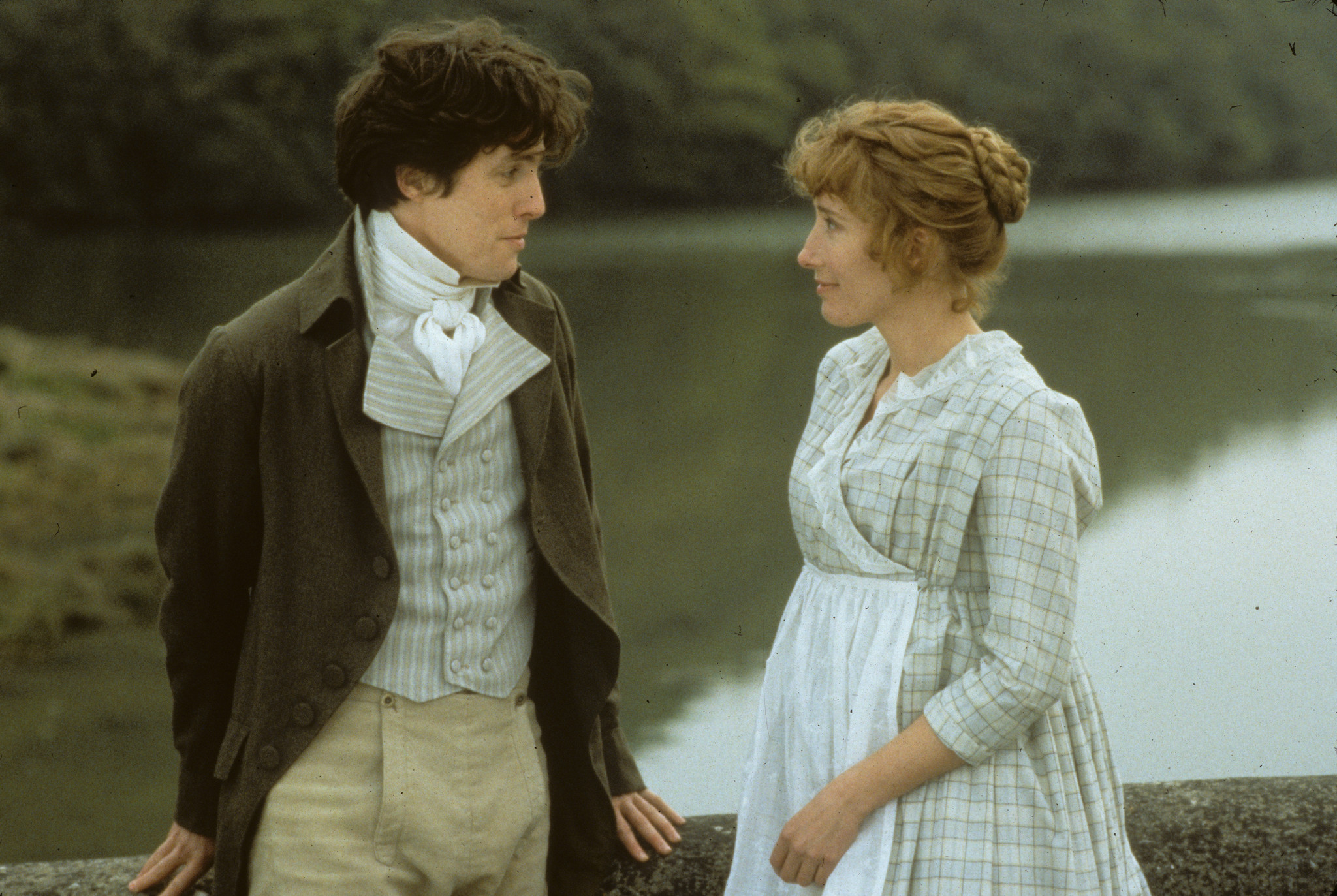 Edward Ferrars talks to Marianne Dashwood beside a lake in Sense and Sensibility
