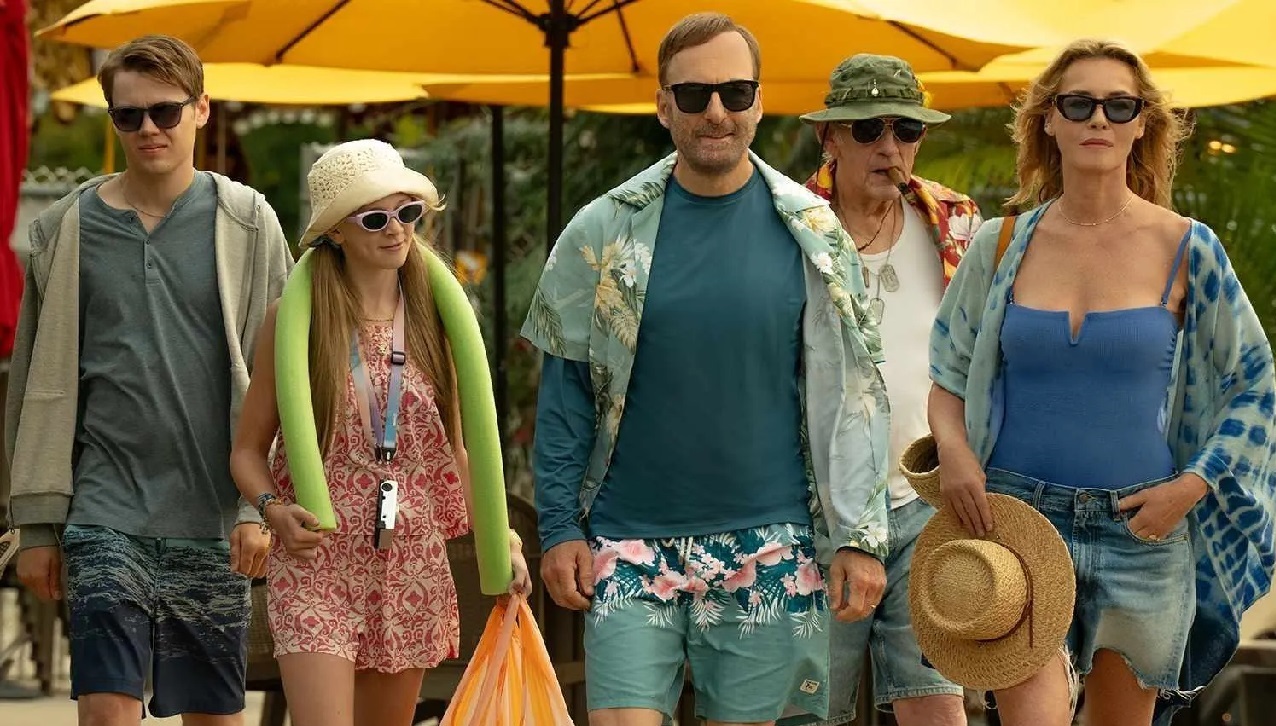 The Mansell family arriving at a theme park in Nobody 2