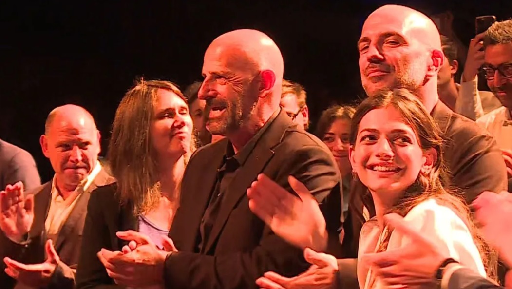 The director and cast of The Kingdom at Cannes receiving applause. 