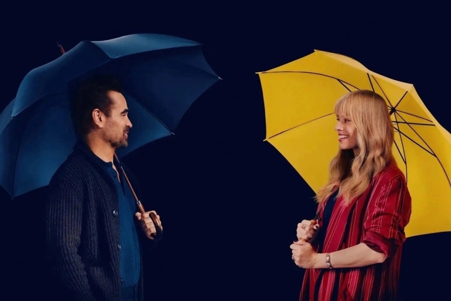 Colin Farrell and Margot Robbie holding coloured umbrellas in A Big Bold Beautiful Journey