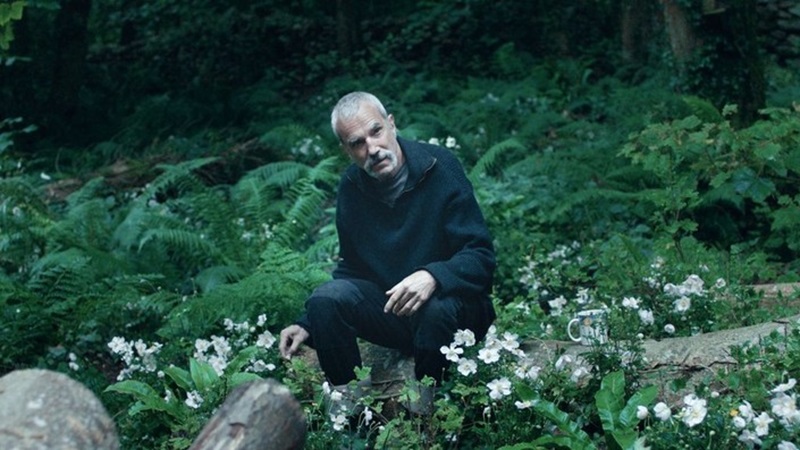 Daniel Day-Lewis as Ray sat among anemones, from the film Anemone.