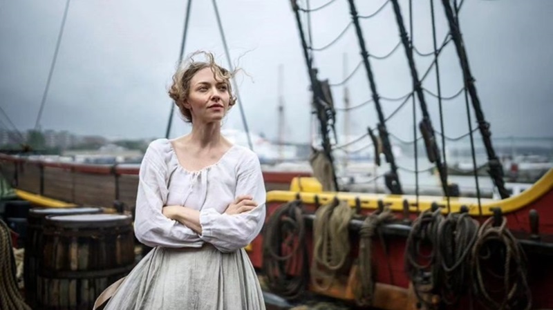 Ann Lee standing on a ship's deck in The Testament of Ann Lee.