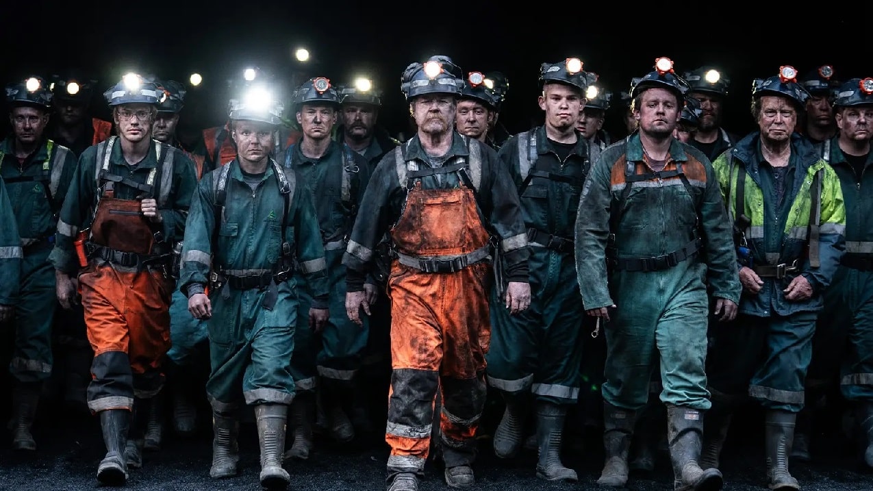 The men from the fateful shift marching out of the mine in Pike River.