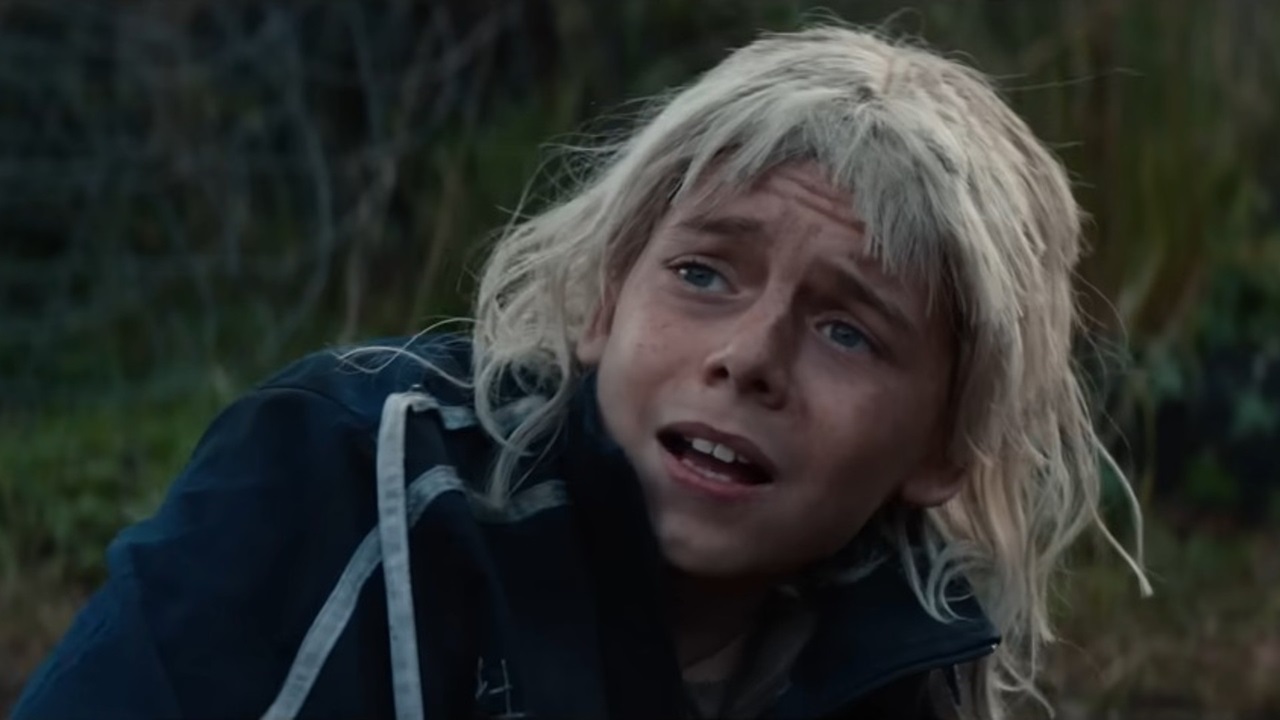 Spike (Alfie Williams) wearing a blond 'Jimmy' wig and looking scared in 28 Years Later: The Bone Temple.