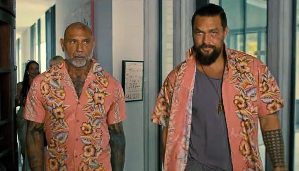 James (Dave Bautista) Jonny (Jason Momoa) wear bright pink Hawaiian shirts in The Wrecking Crew 