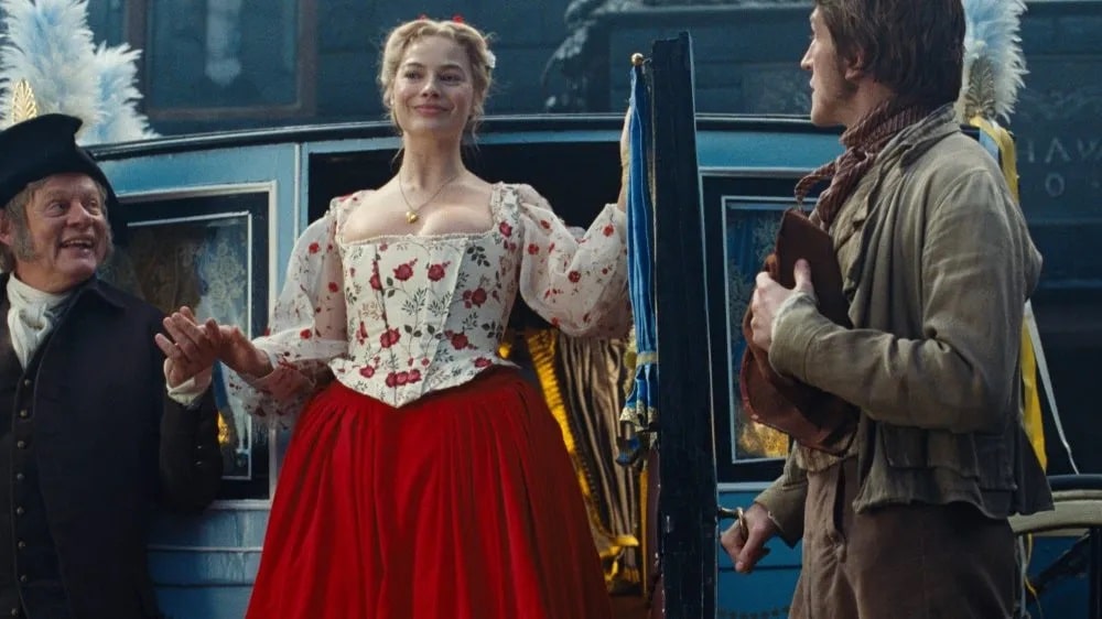Cathy (Margot Robbie) descends from a carriage in "Wuthering Heights"