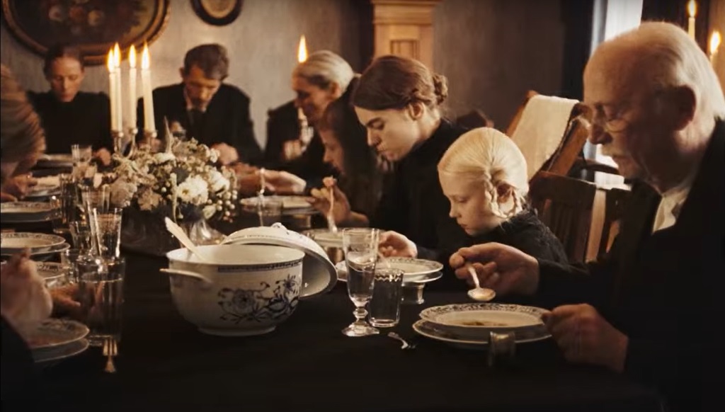 A sombre dinner party in Sound of Falling.