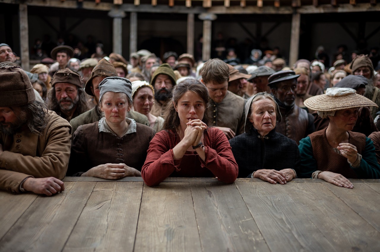 Jessie Buckley has a front row view of Hamlet at the Globe in the film Hamnet.