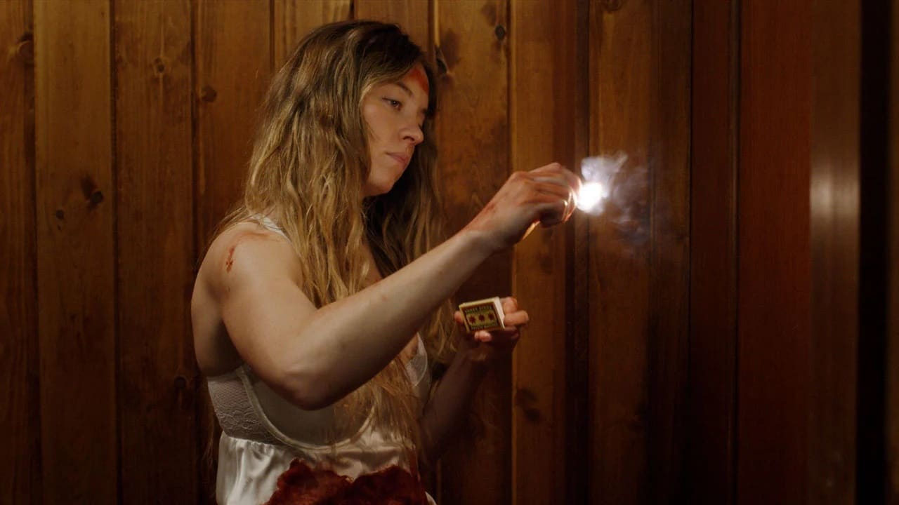 Millie (Sydney Sweeney) lights a match in the film The Housemaid.